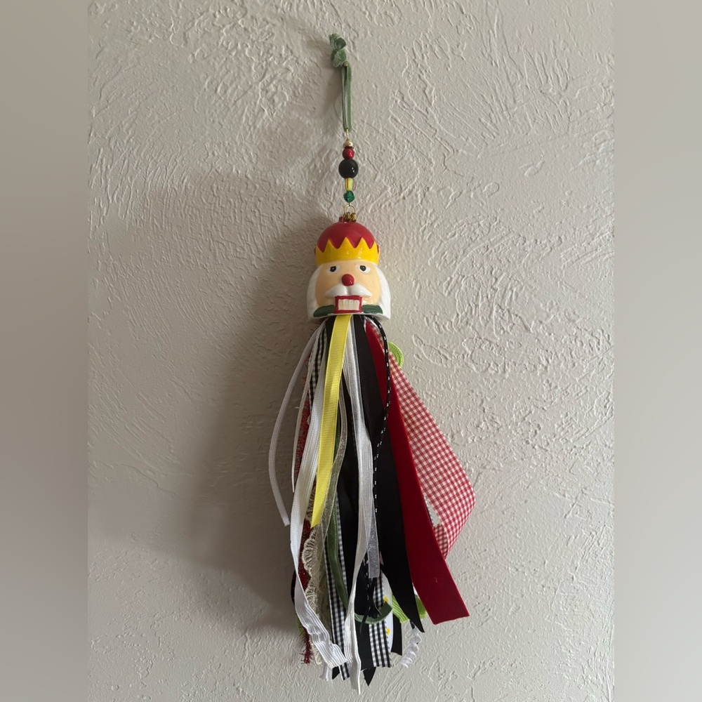 Hand Crafted Nutcracker Tassel Ornament - Red, Yellow, Black, White